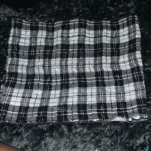 It is in good condition and is a plaid tube top
